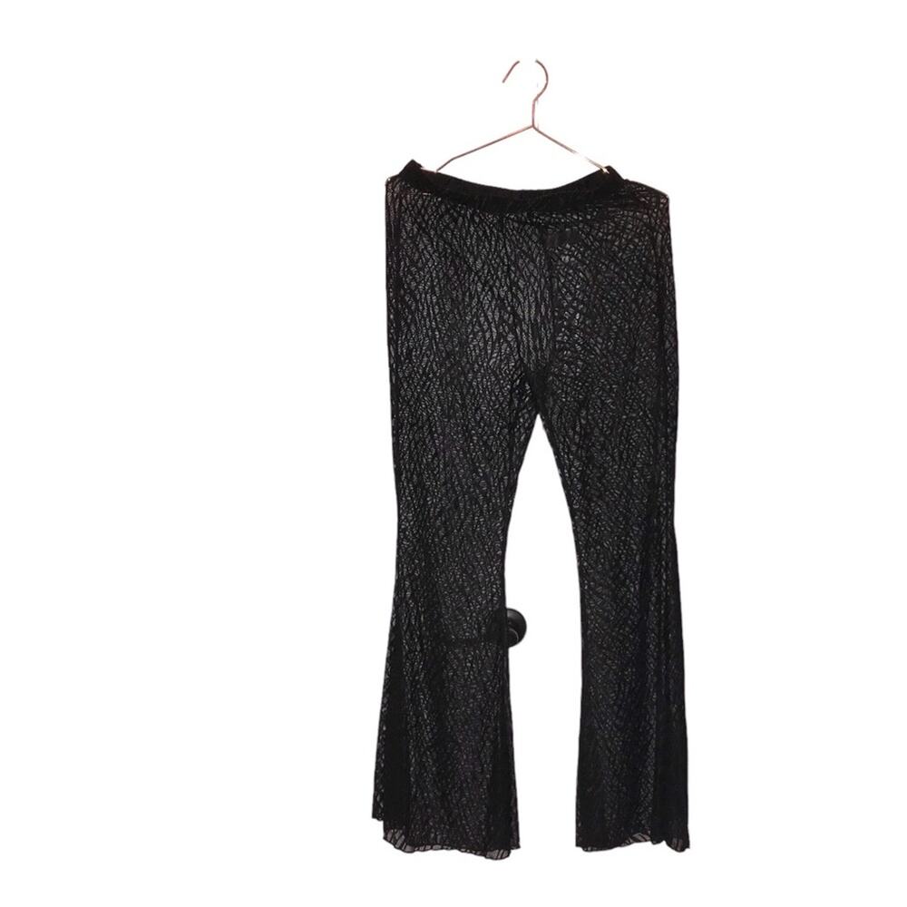 Black semi sheer fore swim pant. No size but fits like large see measurements